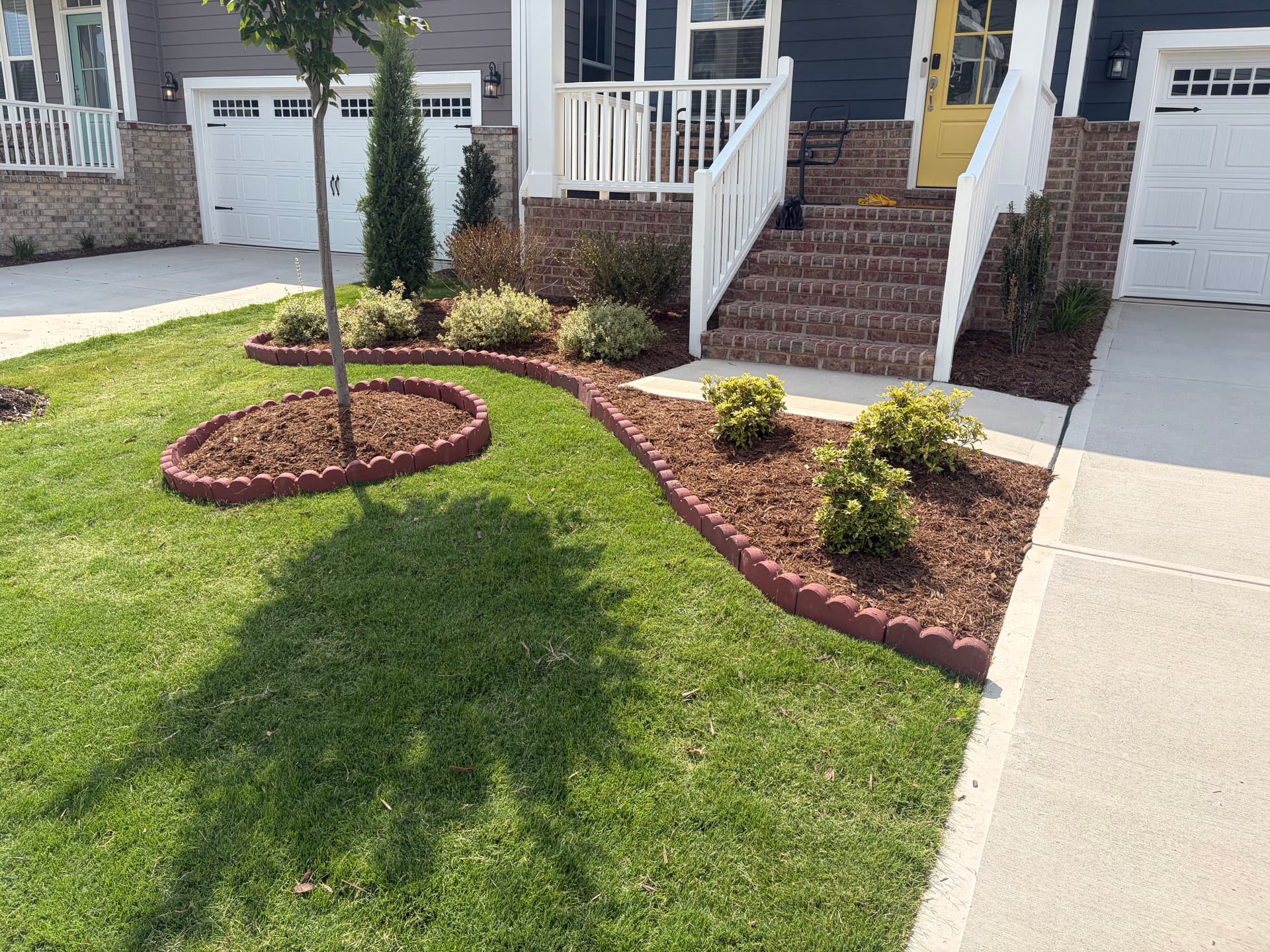 Fresh Mulch and Brick Edging That Makes Beds Look Finished image